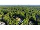 Aerial view of an estate nestled within a lush forest, providing exceptional privacy at 5360 Lake Forrest Dr, Atlanta, GA 30342