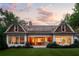 Exterior of a light-filled home with a spacious backyard, windows, and patio area at 5360 Lake Forrest Dr, Atlanta, GA 30342