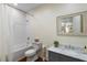 Charming bathroom with a shower/tub, a marble vanity, and board and batten accent walls at 5360 Lake Forrest Dr, Atlanta, GA 30342