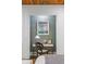 Bedroom nook featuring a small desk, chair, lamp, clock, and framed photo on the wall at 5360 Lake Forrest Dr, Atlanta, GA 30342