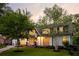 Beautiful house featuring a well-manicured lawn, stone walkway, and elegant curb appeal at 5360 Lake Forrest Dr, Atlanta, GA 30342
