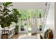 Bright foyer with large windows, an open door to the yard, and a staircase at 5360 Lake Forrest Dr, Atlanta, GA 30342