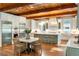 Gourmet kitchen featuring custom cabinets, a large center island with seating, and stainless steel appliances at 5360 Lake Forrest Dr, Atlanta, GA 30342