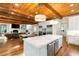 Open kitchen design with a marble island, stainless steel appliances and hardwood floors at 5360 Lake Forrest Dr, Atlanta, GA 30342