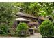 Outdoor restaurant seating amidst lush greenery, creating an inviting atmosphere for diners to enjoy at 5360 Lake Forrest Dr, Atlanta, GA 30342