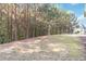 Expansive backyard with mature trees, offering privacy and a natural setting at 700 Ridgeway Ct, Canton, GA 30114