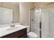 Bathroom featuring a walk-in shower, modern vanity, ample counter space and great natural lighting at 700 Ridgeway Ct, Canton, GA 30114