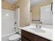 Bathroom features a shower and bathtub combination, along with a stylish vanity and ample lighting at 700 Ridgeway Ct, Canton, GA 30114