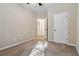 Comfortable bedroom with plush carpeting, natural light, neutral paint and ample space for furnishings at 700 Ridgeway Ct, Canton, GA 30114