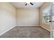 Bedroom featuring a ceiling fan, a window with a view, neutral paint and plush carpet at 700 Ridgeway Ct, Canton, GA 30114