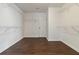 Walk-in closet with ample storage space featuring wood floors and white shelving at 700 Ridgeway Ct, Canton, GA 30114