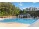 Community pool with lounge chairs and shaded area at 700 Ridgeway Ct, Canton, GA 30114