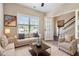 Bright living room with neutral tones, large windows, plush seating and cozy decor at 700 Ridgeway Ct, Canton, GA 30114