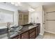 Luxurious bathroom with dual vessel sinks, granite countertops, and a glass-enclosed shower at 700 Ridgeway Ct, Canton, GA 30114