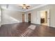 Expansive main bedroom boasts tray ceilings, hardwood floors, and ensuite bathroom access at 700 Ridgeway Ct, Canton, GA 30114