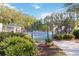 Community tennis court surrounded by lush greenery and a fence at 700 Ridgeway Ct, Canton, GA 30114
