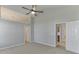 Bedroom with gray walls, vaulted ceiling, ceiling fan, and access to multiple rooms at 2175 Charleston Oak Cir, Lawrenceville, GA 30043