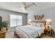 Cozy bedroom featuring ceiling fan, window, and ceiling detail at 2175 Charleston Oak Cir, Lawrenceville, GA 30043