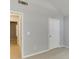 Neutral bedroom with carpet, white trim, vaulted ceiling, and two doors at 2175 Charleston Oak Cir, Lawrenceville, GA 30043