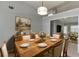 Cozy dining area featuring a rustic wooden table and comfortable seating for six at 2175 Charleston Oak Cir, Lawrenceville, GA 30043