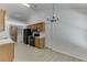Kitchen featuring wood cabinets, black appliances, light countertops, and access to other rooms at 2175 Charleston Oak Cir, Lawrenceville, GA 30043