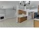Open concept: living room with fireplace connects to kitchen with bar top and stainless steel sink at 2175 Charleston Oak Cir, Lawrenceville, GA 30043