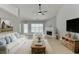 Bright living room features a fireplace, neutral colors, and access to the backyard at 2175 Charleston Oak Cir, Lawrenceville, GA 30043