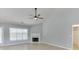 Spacious and bright living room with a fireplace and large windows providing natural light at 2175 Charleston Oak Cir, Lawrenceville, GA 30043