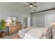 Main bedroom features vaulted ceiling, a ceiling fan, two windows, and neutral colored walls at 2175 Charleston Oak Cir, Lawrenceville, GA 30043