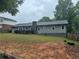 Expansive backyard with a deck, perfect for outdoor gatherings and enjoying the natural surroundings at 2298 Hillbriar Dr, Buford, GA 30518