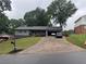 Charming single Gathering home with a well manicured lawn, long driveway and attached garage at 2298 Hillbriar Dr, Buford, GA 30518