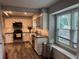 Bright kitchen featuring stainless steel appliances, granite countertops, modern cabinets and a window seat at 2298 Hillbriar Dr, Buford, GA 30518