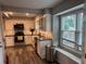 Bright kitchen featuring stainless steel appliances, granite countertops, modern cabinets and a window seat at 2298 Hillbriar Dr, Buford, GA 30518