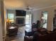 Spacious living room with a fireplace, comfortable seating, and view to the kitchen at 2298 Hillbriar Dr, Buford, GA 30518