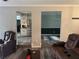Comfortable living room with hardwood floors adjacent to the dining area and kitchen with stainless steel appliances at 2298 Hillbriar Dr, Buford, GA 30518