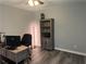 Office with gray walls, a ceiling fan, and laminate flooring including a bookcase and a workspace at 2298 Hillbriar Dr, Buford, GA 30518