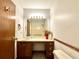 Bathroom featuring a single sink vanity, toilet, and mirror at 3436 Finglas Dr, Marietta, GA 30008