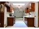 Functional kitchen featuring wooden cabinetry, white countertops, and a bright skylight at 3436 Finglas Dr, Marietta, GA 30008