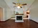 Inviting living room featuring a brick fireplace, wood floors, and vaulted ceilings at 3436 Finglas Dr, Marietta, GA 30008