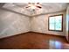Expansive bedroom featuring hardwood floors, a ceiling fan, and natural light at 3436 Finglas Dr, Marietta, GA 30008