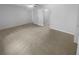 Spacious bedroom with neutral carpet, a ceiling fan, white walls and closet access at 4504 Cedar Ridge Trl, Stone Mountain, GA 30083
