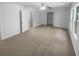 Bright bedroom features neutral carpet, a ceiling fan, and closet access at 4504 Cedar Ridge Trl, Stone Mountain, GA 30083