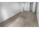 Bright bedroom featuring neutral carpet, white walls and convenient closet access at 4504 Cedar Ridge Trl, Stone Mountain, GA 30083