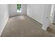 Neutral bedroom with plush carpeting and large window at 4504 Cedar Ridge Trl, Stone Mountain, GA 30083