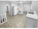 Bright and modern kitchen with white cabinets, appliances, and ample counter space at 4504 Cedar Ridge Trl, Stone Mountain, GA 30083