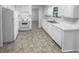 Open kitchen featuring white appliances, countertops and cabinetry at 4504 Cedar Ridge Trl, Stone Mountain, GA 30083