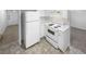Kitchen featuring white appliances, countertops and cabinetry at 4504 Cedar Ridge Trl, Stone Mountain, GA 30083