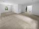 Bright, open living area with ample natural light and neutral carpeting at 4504 Cedar Ridge Trl, Stone Mountain, GA 30083