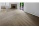 Bright living room with neutral carpet, a brick fireplace and a sliding glass door at 4504 Cedar Ridge Trl, Stone Mountain, GA 30083
