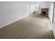 Spacious living room features neutral carpet, fireplace, white walls and natural light from sliding glass doors at 4504 Cedar Ridge Trl, Stone Mountain, GA 30083